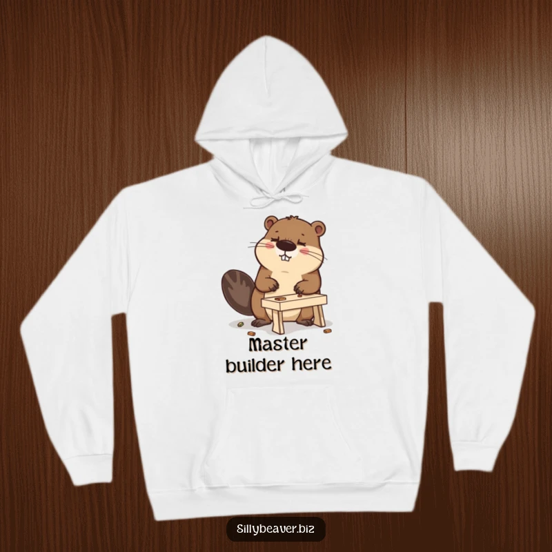 Funny hoodie showcasing a determined beaver intently building a miniature desk, blending comfort with comical work ethic.